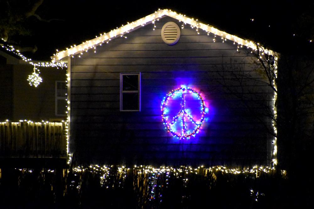 a peace sign lights up the back of the storage shed